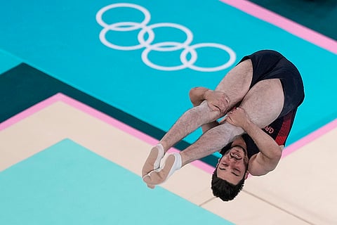 Zak Perzamonos of Britain competes during men's trampoline finals